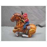 Tin Cowboy on Horse Wind-Up Toy
