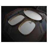 Three Oval Mirrored Trays With Gilded Details
