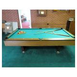 Pool Table With Sticks and Balls