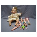 Doll Collection With Large Baby Doll