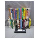 25 VHS Tapes with Mixed Titles