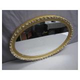 Oval Wall Mirror with Ornate Gold Frame Design