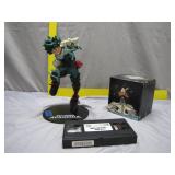 Pop Culture Collectibles: Figure, Mug, and VHS