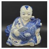 Porcelain Child Figure with Fish Motif