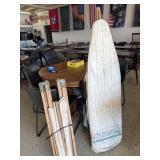 Military cot and wood ironing board