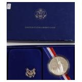 PROOF ELLIS ISLAND SILVER DOLLAR W BOX PAPERS