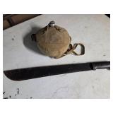 Machete and boyscout canteen