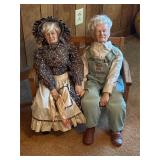 Grandpa  grandma dolls sitting in rocking bench