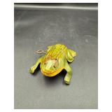vintage tin toy frog with a winding key
