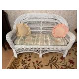 Vintage wicker loveseat inside kept