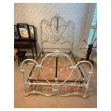 Antique Victorian-style cast iron bed frame