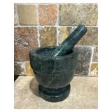 green marble mortar and pestle