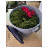 Garbage Can Filled with Christmas Wreaths