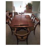 Wooden table and 6 chairs 2 leafs 1 chair has