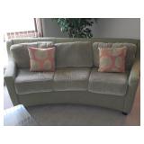 light green 3-seat sofa with a curved back design