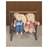 Handmade bunnies on wooden swing