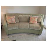 light green 3-seat sofa with a curved back design