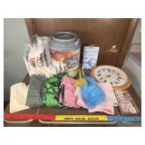 Kitchen aprons, napkins, popcorn tin, bird clock