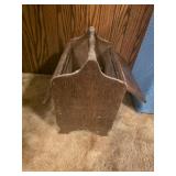 Wooden sewing box featuring a carry handle and