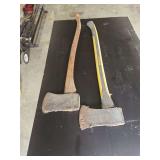 Two Wood-Cutting Axes Including Truper Brand with Composite Handle and Unmarked Axe with Wooden Handle