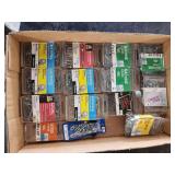 Assorted Hardware Fasteners, Screws, and Self-Drilling Screws in Plastic Packaging