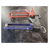Two Caulking Guns, Red and Blue Metal and Plastic