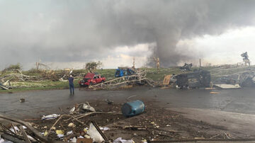 Kim Houlden, BinMaster marketing coordinator, captures the tornado amidst destruction.