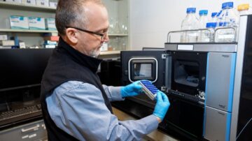 Research associate Wayne Anderson loads bee samples into a liquid chromatography mass spectrometer for analysis in the lab of Scott McArt in Comstock Hall. (Jason Koski/Cornell University)