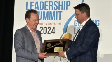 Dave Armstrong, left, passes the ASTA chair's gavel to Dan Foor. (Chris Lusvardi photos)