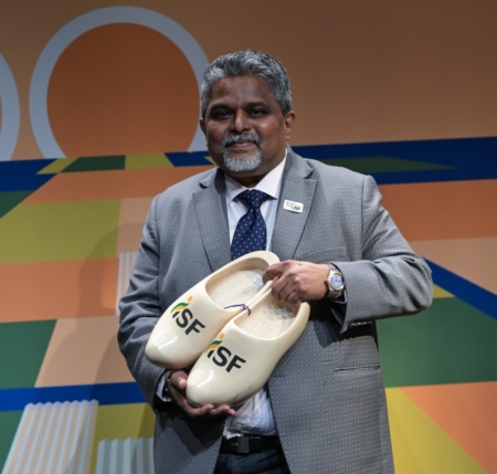 As a parting gift, former ISF President Marco van Leeuwen presented Attavar with a pair of traditional Dutch wooden clogs.