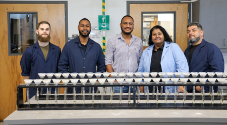 Members of Everglades Soil Testing Lab stand behind a filtration experiment of soil extract for analysis.
(L-R) Lab assistant Samuel Liss, lab technician Cartavious Baldwin, lab director and assistant professor Niguss Hailegnaw, lab manager and chemist Rani Ramlakhan and Antonio Ayala, lab assistant. (Avery Harrison/ UF/IFAS EREC)