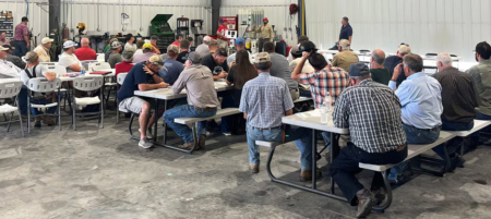 Bayer agronomists talking through options with UNL extension agents in the background. (Left to right): Channel Agronomist Trenton Houston, Channel Agronomist Chris Anderson, Learning Center Agronomist Shawn McDonald, and Learning Center Agronomist Alex Rosa.
