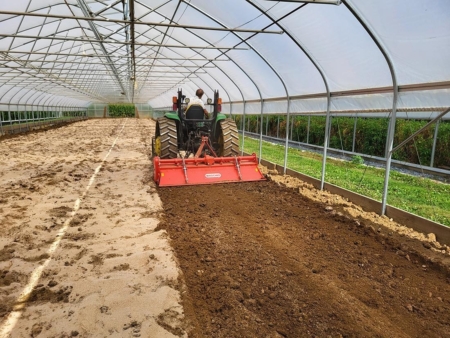 Anaerobic soil disinfestation consists of incorporating easily decomposable organic amendments into the soil, shown here, followed by irrigation to saturation and covering the soil with impermeable plastic. (Credit: Francesco Di Gioia/Penn State)