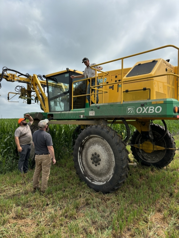 The Beck’s team frequently stops to check crop conditions and the progress of the work being done such as detasseling. (Chris Lusvardi)