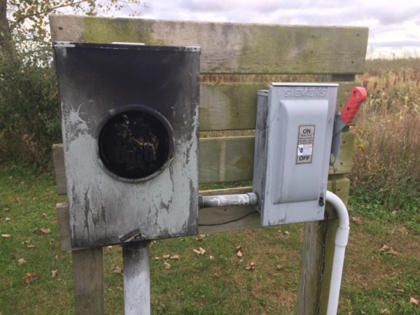 Lightning damage to electrical supplies, like this blown out meter socket, presents a need for immediate repair and the risk of downline damage of equipment. (Photo by Lyndon Kelley, MSU Extension)