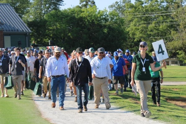 The 2024 Turfgrass Research Field Day, held Aug. 7 at UGA-Griffin, began with a guided research tour. Visiting eight stations, attendees received CAES expert advice to improve precision irrigation management, disease control, soil testing and fertility management for turf. (Photo by Ashley Biles)