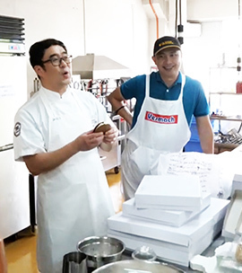 Redondo, right, enjoys working with technologists from other USW offices, calling the promotion of U.S. wheat “a team effort.” Here he works with David Oh from the USW Seoul Office. Photo credit: USW.