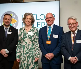 In the image, from left to right: Terry Jermy, MP for South West Norfolk; Emily Miles, director general for Food, Farming, and Biosecurity at the Department for Environment, Food, and Rural Affairs; Mike Peters, president at UK Flour Millers and milling group advisor at Whitworth Bros Ltd; and Alistair Gale, chief executive officer at UK Flour Millers. Photo credit: UK Flour Millers.