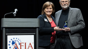 Jerry May was presented with the AFIA Friend of Pet Food Award by AFIA President and CEO Constance Cullman. Image courtesy of AFIA.