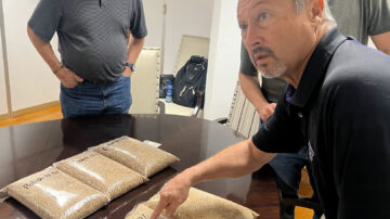 Kansas farmer Gary Millershaski visiting a flour mill in Nigeria. Photo credit: U.S. Wheat Associates.