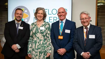In the image, from left to right: Terry Jermy, MP for South West Norfolk; Emily Miles, director general for Food, Farming, and Biosecurity at the Department for Environment, Food, and Rural Affairs; Mike Peters, president at UK Flour Millers and milling group advisor at Whitworth Bros Ltd; and Alistair Gale, chief executive officer at UK Flour Millers. Photo credit: UK Flour Millers.