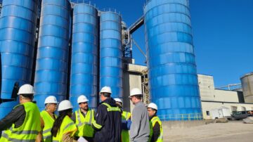 Last week, a Global Ethanol Summit (GES) post-team of Mexican researchers, government officials and industry stakeholders visited Wisconsin to view the U.S. bioethanol value chain. Pictured, team members discuss the ethanol fermenting process at Azatlan Bio. Image courtesy of USGBC.