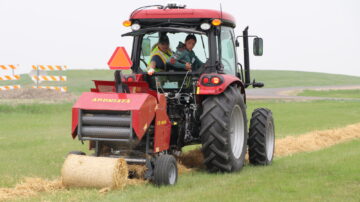 Youth learn the basics of safe tractor and machinery operation at an NDSU Extension youth farm safety camp. Photo credit: NDSU.