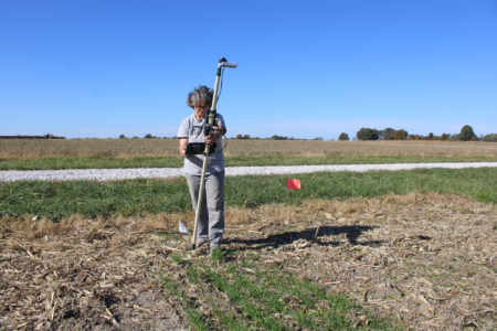 At the Bradford Research Farm, Kerry Clark uses a camera-based device to measure cover crop performance. Photo credit: Ainur Aibyek, University of Missouri.