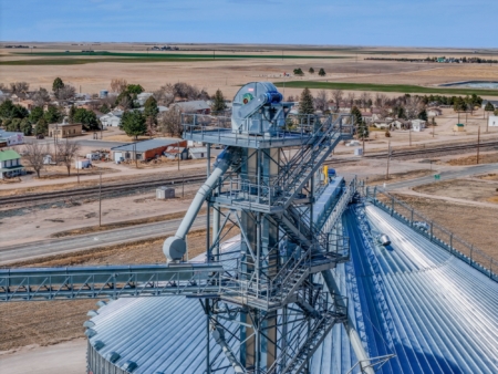 Chief conveyors, bucket elevators, catwalks and tower support equipment connect the additional storage to the facility’s existing grain handling system. Photo credit: Peetz Farmers Co-op.