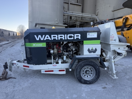 Wet shotcrete pump set up outside of silo. Photos by CCS
