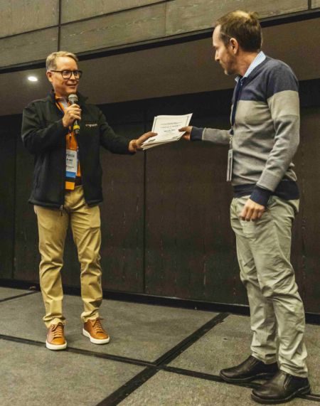 USW Director of Technical Services Marcelo Mitre, right, is given a certificate of appreciation by a representative of the International Association of the Operative Millers (IAOM) Latin America after his presentation on U.S. wheat. Photo credit: USW.