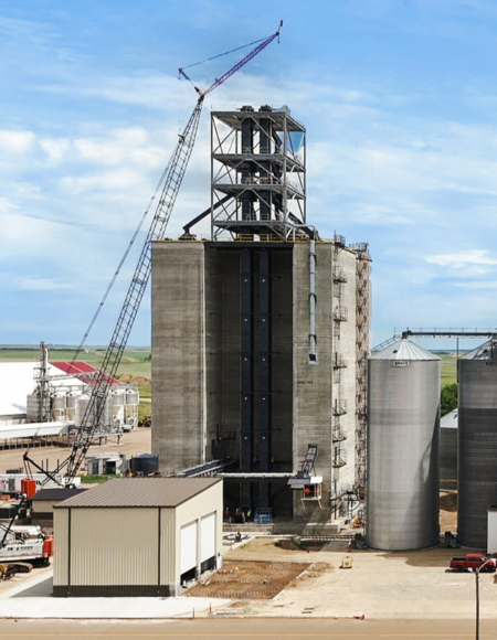 The 630,000-bushel four-pack slip-form elevator under construction at Scranton Equity Exchange. Four concrete cores form the centerpiece of the cooperative’s $23 million expansion.