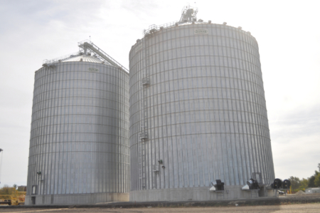 Two new Sukup steel tanks hold 613,000 bushels at left and 844,000 bushels at right.
