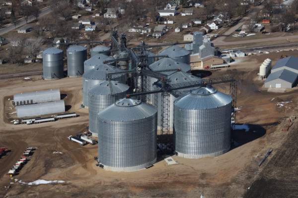 Farmers Coop Elevator Co. elevator in Bellingham, MN, with newest Behlen 750,000-bushel tank at bottom right.